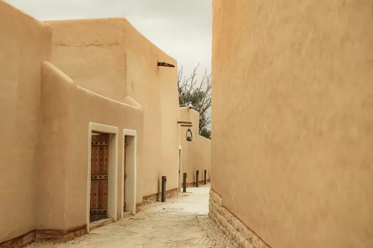 photo of colorful colombian houses with a colombia flag handing over