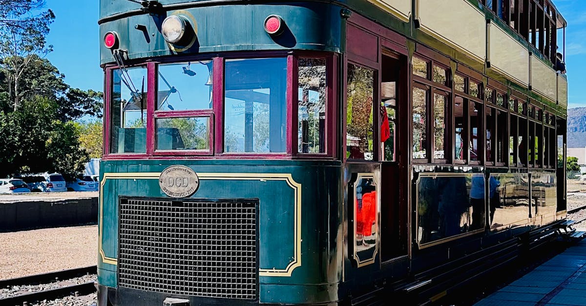 photo of colombian women with fruit on their head walking down the street with stools in their left hand