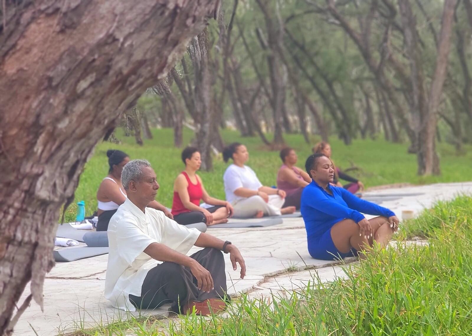 photo of a group of women all wearing gold shirts that say sisters